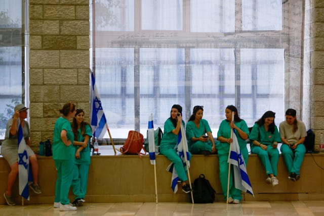  Doctors attend an emergency conference organized by the Histadrut, on the Israeli government's planned judicial overhaul, at the ICC in Jerusalem. July 23, 2023. (photo credit: Chaim Goldberg/Flash90)