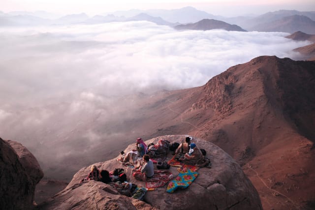  Visitors watch sunrise from Mount Sinai in Egypt, where Moses is believed to have received the 10 Commandments.