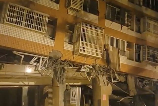  A building, which, according to the Hualien government, is unoccupied after it was previously damaged in an earlier quake on April 3, is seen following a series of earthquakes, in Hualien, Taiwan April 23, 2024 in this still image obtained from social media video.  (photo credit: VIA REUTERS)