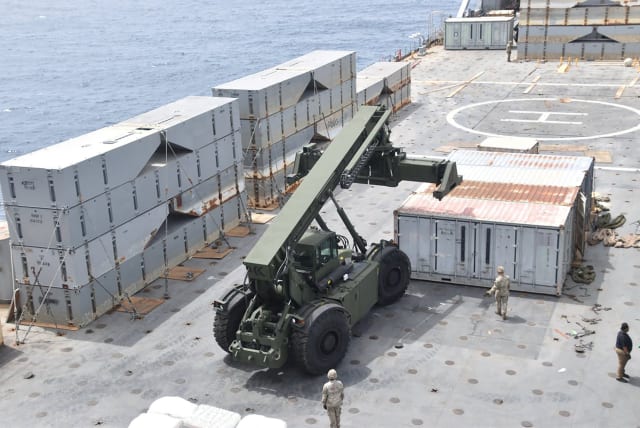  US Navy personnel construct a JLOTS, which stands for "Joint Logistics Over-the Shore" temporary pier which will provide a ship-to-shore distribution system to help deliver humanitarian aid into Gaza, in an undated handout picture in the Mediterranean Sea. (photo credit: US CENTRAL COMMAND/HANDOUT VIA REUTERS)