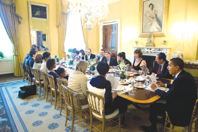  THEN-US PRESIDENT Barack Obama and his wife, Michelle, host a Passover Seder with friends and staff in the Old Family Dining Room at the White House in 2009.  (photo credit: REUTERS)