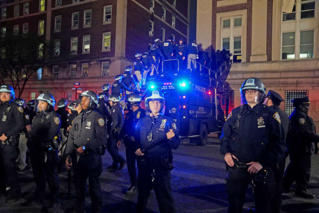  Police use a special vehicle to enter Hamilton Hall which protesters occupied, as other officers enter the campus of Columbia University, New York City, US, April 30, 2024. (photo credit: REUTERS/David Dee Delgado)