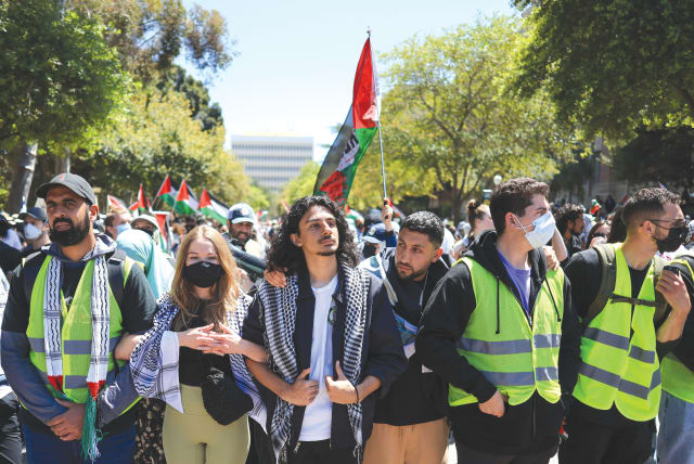  PROTESTERS ATTEND a demonstration in support of Palestinians in Gaza, at UCLA in Los Angeles, this week. Members of nearby Jewish communities now take detours to avoid confrontational student protests, the writer notes. Uploaded on 1/5/2024 (photo credit: REUTERS/DAVID SWANSON)