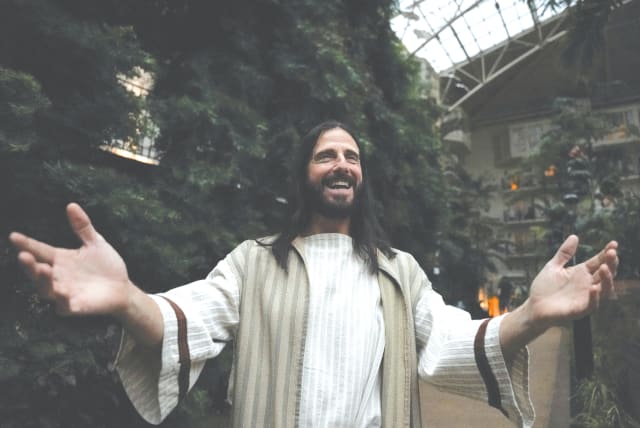  A MAN PORTRAYS Jesus at the 2024 National Religious Broadcasters Association International Christian Media Convention, addressed by former US president and current Republican presidential candidate Donald Trump, in Nashville, Tennessee, in February.  (photo credit: Seth Herald/Reuters)