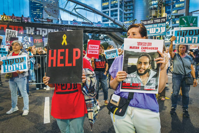  DEMONSTRATORS CALL for the release of the hostages held in the Gaza Strip, this week in Tel Aviv. ‘One thing is made consistently clear by this government: The hostages are not the top priority,’ the writer asserts. (photo credit: AVSHALOM SASSONI/FLASH90)
