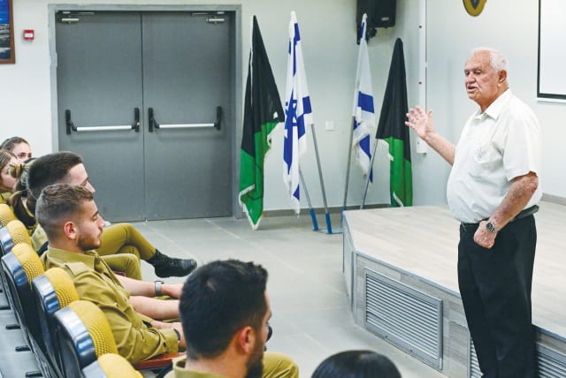  HOLOCAUST SURVIVOR Haim Grinberg addresses IDF officers and soldiers, marking Holocaust Remembrance Day, last year. (photo credit: MICHAEL GILADI/FLASH90)