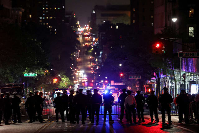  NYPD law enforcement officials hold a perimeter of closed streets surrounding Columbia University anti-Israel encampment (photo credit: REUTERS/CAITLIN OCHS/FILE PHOTO)