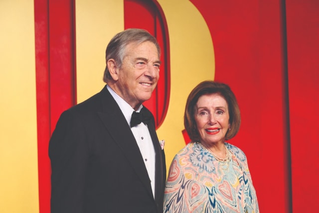  Nancy Pelosi and her husband, Paul Pelosi, arrive at the Vanity Fair Oscar party after the 96th Academy Awards ceremony in Beverly Hills on March 10. (photo credit: DANNY MOLOSHOK/REUTERS)