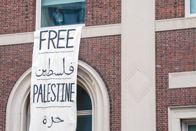  A ‘FREE PALESTINE’ banner is hung from a window of Hamilton Hall at Columbia University, last week. The harassment of Jewish students, and the demonization of Israel on college campuses – this is an attack on our entire civilization, the writer argues. (photo credit: David Dee Delgado/Reuters)