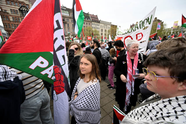  Climate activist Greta Thunberg takes part in the Stop Israel demonstration against Israel's participation in the 68th edition of the Eurovision Song Contest (ESC) in Malmo, Sweden, May 9, 2024.  (photo credit: TT News Agency/Johan Nilsson via REUTERS)