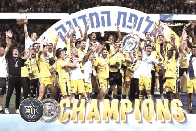  MACCABI TEL AVIV celebrates after Saturday’s 3-0 victory over Hapoel Beersheba secured the Israel Premier League title. (photo credit: MACCABI TEL AVIV/COURTESY)