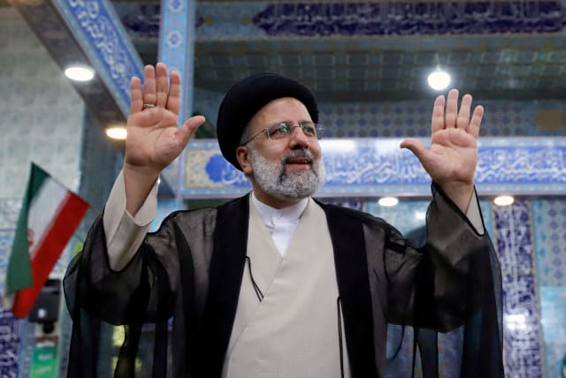   Presidential candidate Ebrahim Raisi gestures after casting his vote during presidential elections at a polling station in Tehran, Iran June 18, 2021.