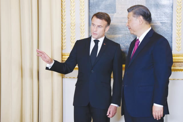  FRANCE’S PRESIDENT Emmanuel Macron speaks with Chinese President Xi Jinping ahead of an official state dinner at the Elysee Palace in Paris, during the Chinese president’s two-day state visit to France, earlier this month. (photo credit: LUDOVIC MARIN/REUTERS)