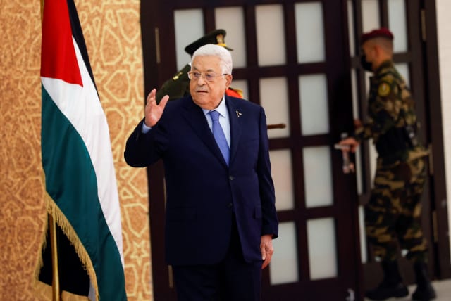  Palestinian President Mahmoud Abbas gestures, as he attends a swearing-in ceremony for the newly formed cabinet, in Ramallah, in the West Bank, March 31, 2024. (photo credit: REUTERS/Mohammed Torokman)