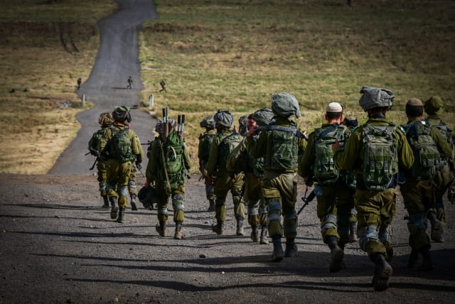 Israeli soldiers from the Golani brigade take part in a military drill in the Golan Heights, northern Israel, May 22, 2024 (photo credit: MICHAEL GILADI/FLASH90)
