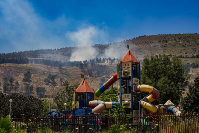 Fire caused from rockets fired from Lebanon, outside the northern Israeli town of Kiryat Shmona, June 1, 2024 (photo credit:  Ayal Margolin/Flash90)