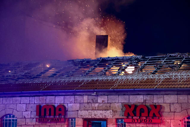  Israeli firefighters try to extinguish a fire which broke at the Ima Restaurant, in Jerusalem, June 6, 2024. (photo credit: Dor Pazuelo/Flash90)
