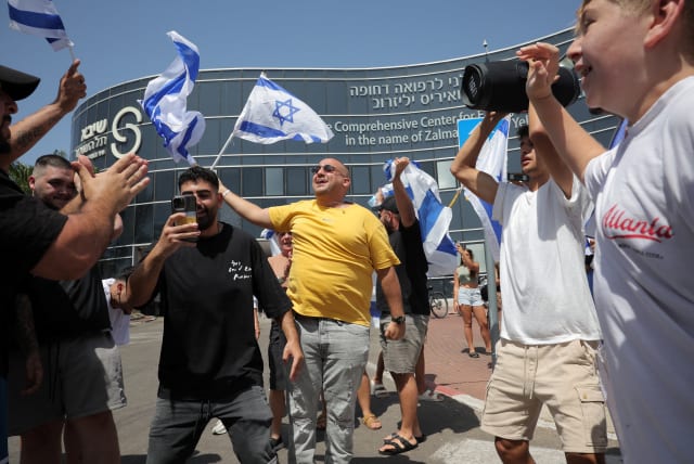 Israelis celebrate the release of four hostages in Ramat Gan on June 8, 2024 (photo credit: REUTERS/MARKO DJURICA)
