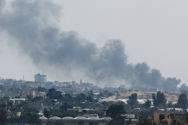  SMOKE RISES following Israeli strikes in Rafah. While the government could get the IDF to drag out the operation in Rafah for an extra week or two, it won’t be able to do that for long, the writer argues.  (photo credit: MOHAMMED SALEM/REUTERS)