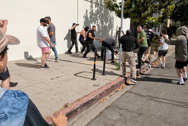  Pro-Palestinian protesters clash with counter-protesters, near Adas Torah synagogue in Pico-Robertson neighborhood, California, U.S., June 23, 2024, in this still image obtained from a video. (photo credit: REUTERS/SHAY HORSE)