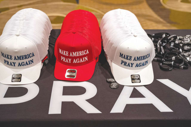  HATS WITH the slogan ‘Make America Pray Again’ are displayed at the National Religious Broadcasters Association International Christian Media Convention, addressed by Donald Trump, in Nashville, in February. (photo credit: Seth Herald/Reuters)