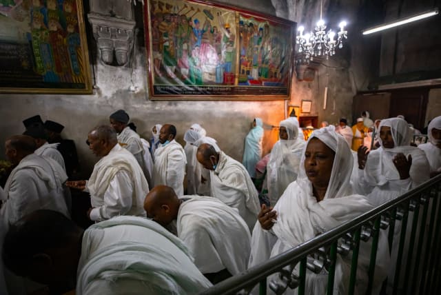  Ethiopian Orthodox Christians pray in the Deir Al-Sultan in the Church of the Holy Sepulcher, traditionally believed to be the site of the crucifixion of Jesus Christ, as the celebrate easter in Jerusalem's Old City on April 29, 2021.