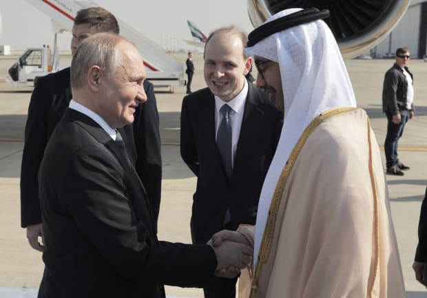  Russian President Vladimir Putin is welcomed by Minister of Foreign Affairs of the United Arab Emirates Sheikh Abdullah bin Zayed bin Sultan Al Nahyan upon arrival at the Abu Dhabi International Airport, United Arab Emirates December 6, 2023