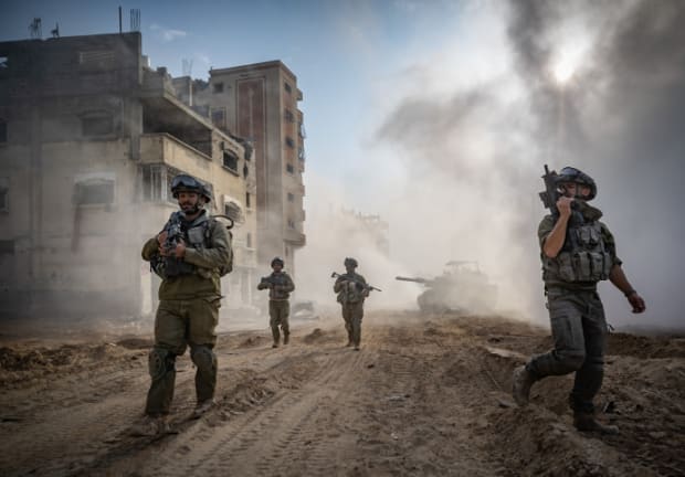  Israeli soldiers from the 8717 Battalion of the Givati Brigade operating in Beit Lahia, in the northern Gaza Strip, during an Israeli military operation in the Gaza Strip, December 28, 2023