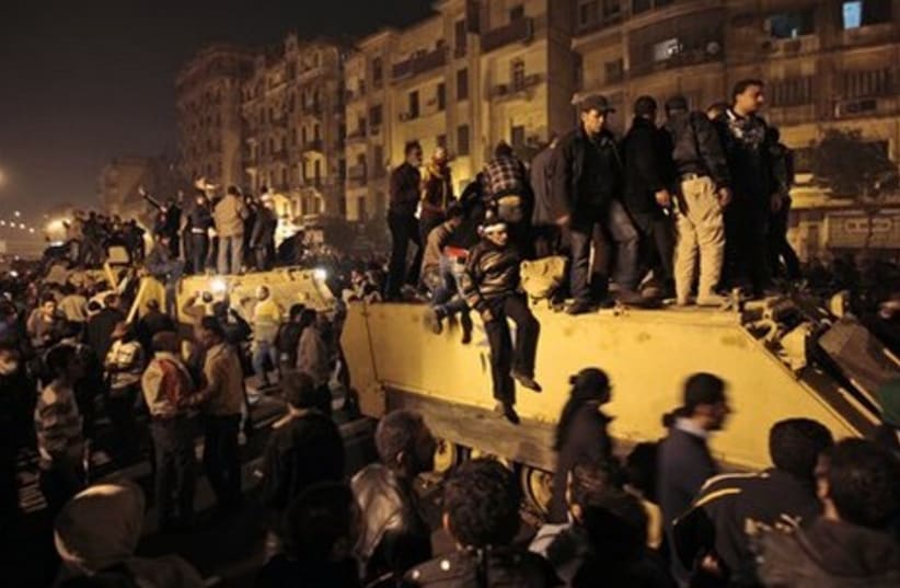 Egypt protesters on a military APC - Gallery