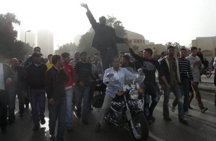 Egyptian protesters on motorcycle 520
