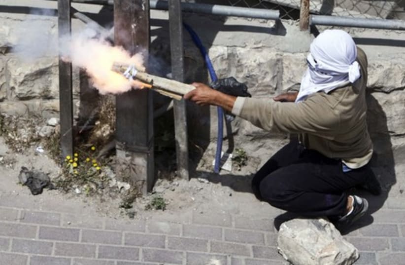 Palestinians firing homemade weapon in Silwan GALLERY