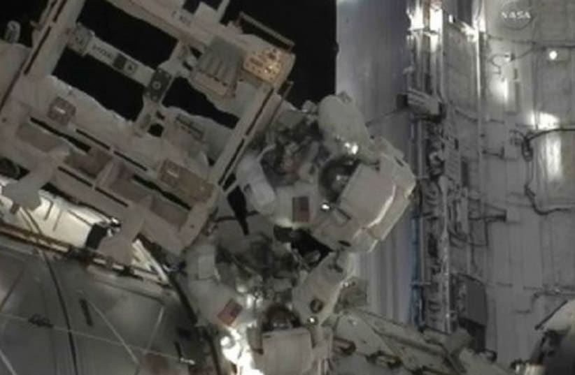 Astronauts working during a spacewalk GALLERY