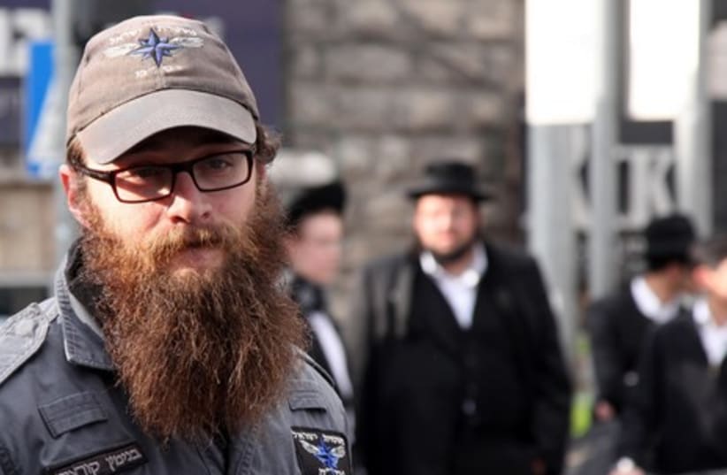 A police officer at Mea Shearim demonstration