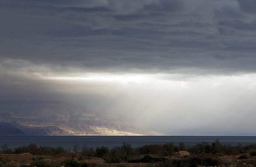 Sun shines through the storm at the Dead Sea