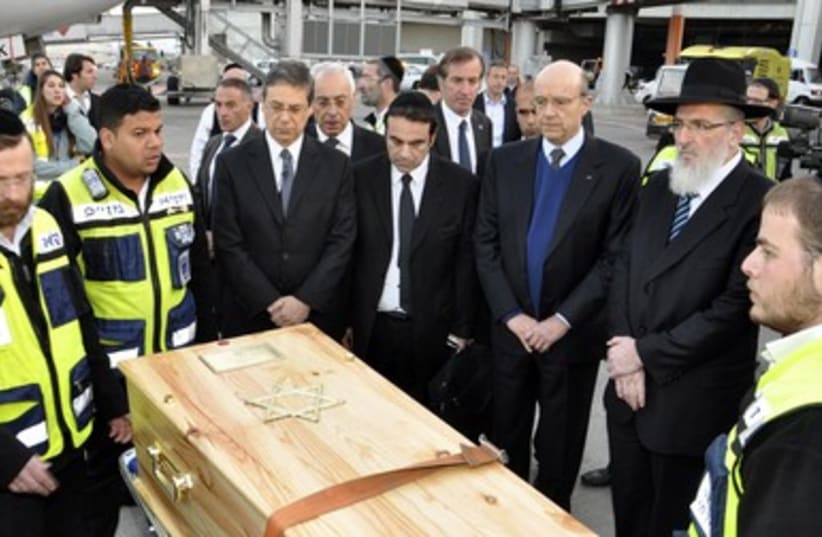 French, Israeli officials with the victims bodies