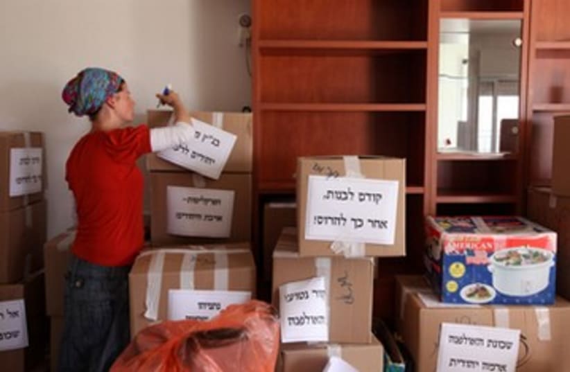 Boxes bearing slogans in Ulpana home