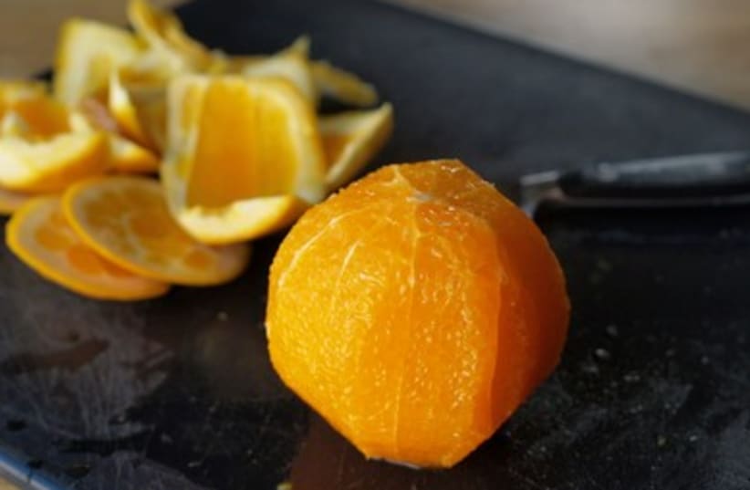 Orange peeled and ready to segment or slice