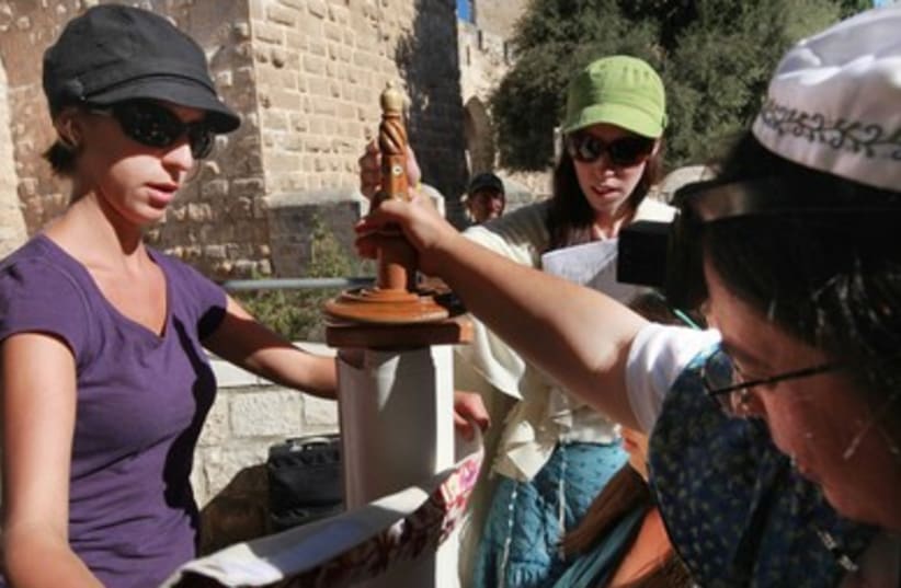 Woman Closes Torah Scroll 390