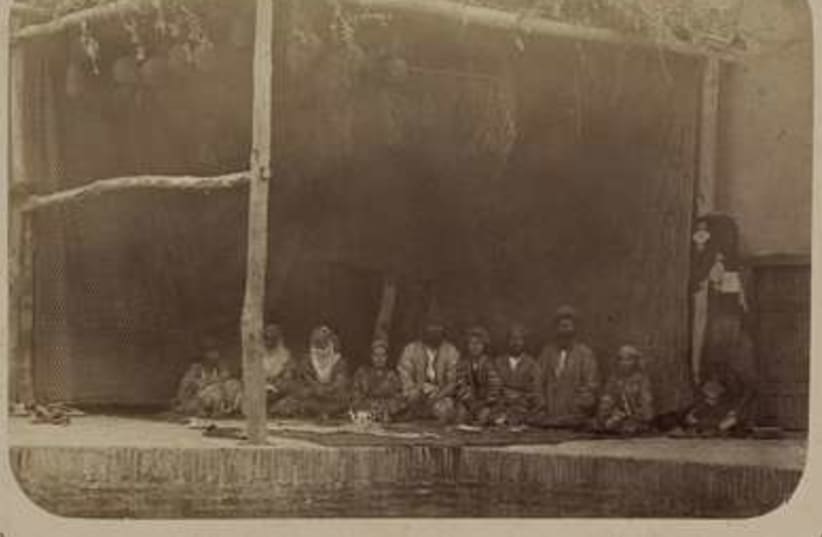 Jews sitting in their Samarkand Sukka (circa 1870) 