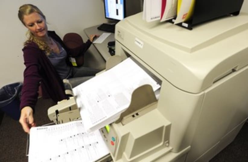 Election worker counts ballots in Colorado 370 (R)