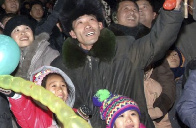 North Koreans watch fireworks to greet the new year in Pyong