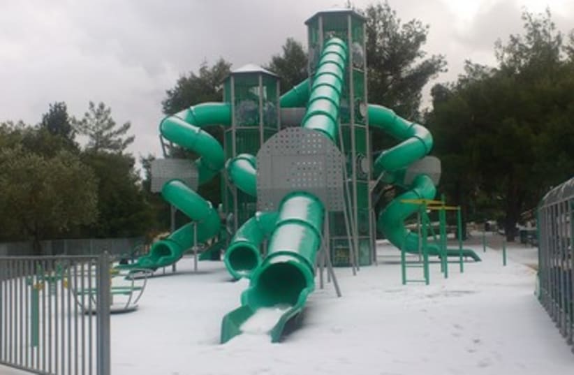 Children's playground in Gilo covered in Snow 390