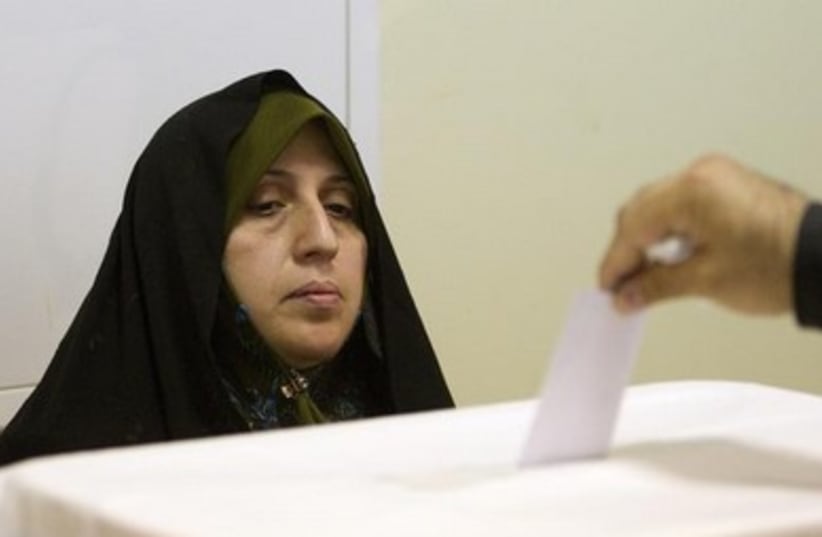 iranian election woman watches ballot cast  390