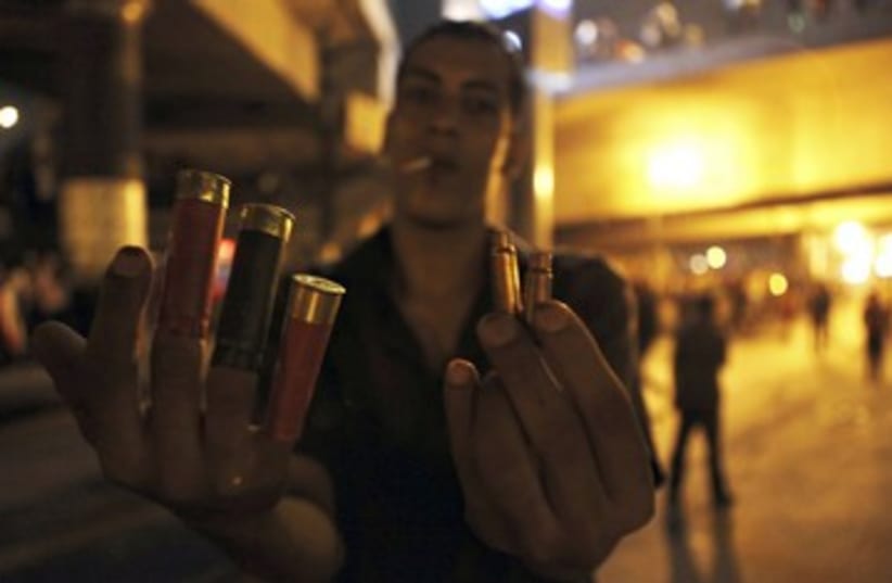 Egyptian protester holds bullets 390