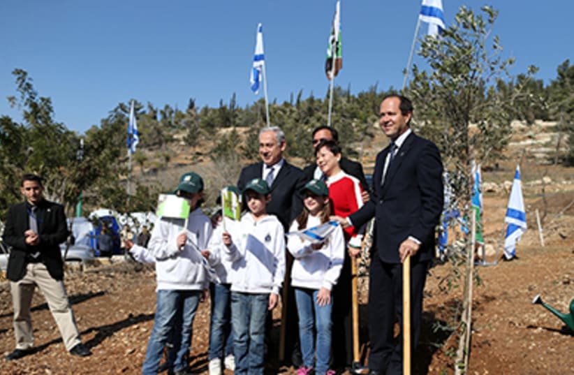 Netanyahu planting trees for Tu Bishvat. Jan 15, 2014