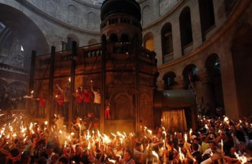 Worshippers take part in the Christian Orthodox Holy Fire ceremony at the Church of the Holy Sepulchre in Jerusalem.