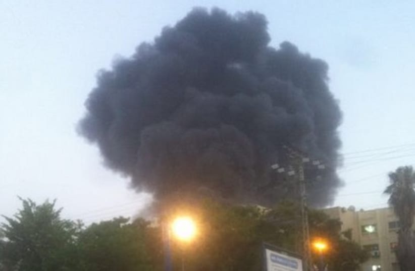 Sderot factory catches fire after begin hit by a rocket from Gaza.