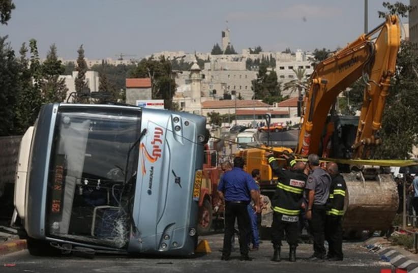 Bus flipped by tractor in Jerusalem terror attack