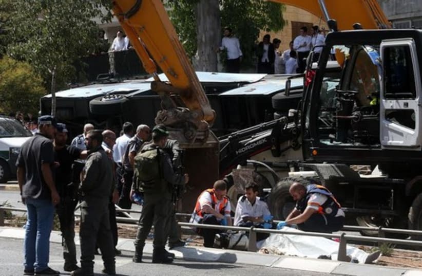 Terrorist in a tractor overturns a bus in Jerusalem, killing one.