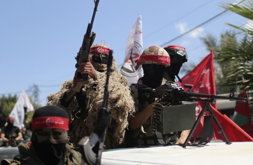 Palestinian militants from the Popular Front for the Liberation of Palestinian (PFLP) take part in a military show in Gaza City September 2
